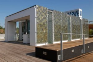 This glass house eco home was designed at Stuttgart University so that it produces more energy than it uses, thus feeding into the national grid.
